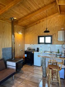 Η κουζίνα ή μικρή κουζίνα στο Cabañas BERGHAUS +10 φωτογραφίες