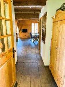 a hallway with a dining room and a table at Haus Itten in Hondrich