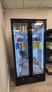 a refrigerator filled with lots of food and drinks at MARS Hotel Seaview Blackpool in Blackpool
