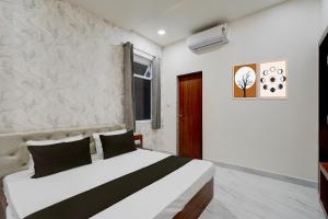 Ένα ή περισσότερα κρεβάτια σε δωμάτιο στο Hotel O Memory Inn