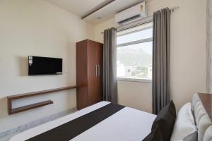 Ένα ή περισσότερα κρεβάτια σε δωμάτιο στο Hotel O Memory Inn