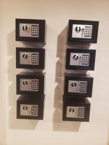 a group of three microwaves on a wall at Lucky Guest House in Phi Phi Islands +21 photos
