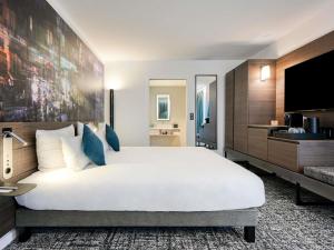 Postel nebo postele na pokoji v ubytování Novotel Paris Centre Bercy