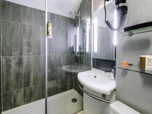 a bathroom with a shower and a sink and a toilet at ibis Avignon Centre Gare in Avignon