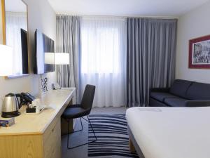 Ένα ή περισσότερα κρεβάτια σε δωμάτιο στο Novotel Manchester West