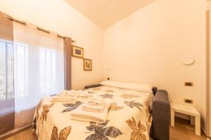 a bedroom with a bed with towels on it at Casicarillo 800 in Serino