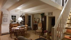 a living room with a table and a dining room at QUIBERON Maison Le Manémeur Port Maria in Quiberon