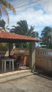 a table and chairs under a pavilion on a patio at Casa Aver o Mar in Sirinhaém +13 photos