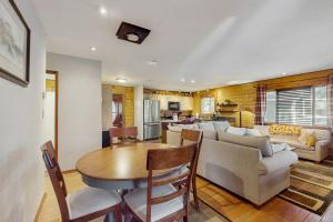 a kitchen and living room with a table and a couch at Fairy Trail in Mountainaire