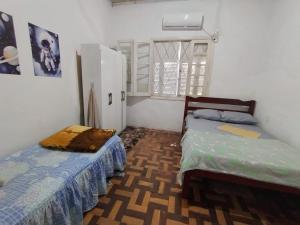 Postel nebo postele na pokoji v ubytování Hospedagem Becker