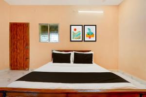 Ένα ή περισσότερα κρεβάτια σε δωμάτιο στο Hotel O ATR Residency