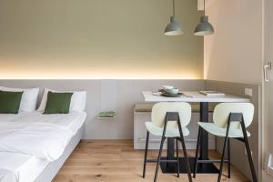 Postel nebo postele na pokoji v ubytování Casa Kaleido