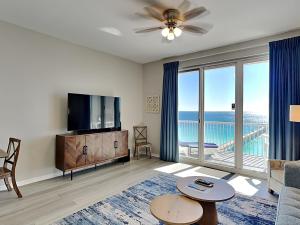 a living room with a view of the ocean at Inn at Summerwinds #1403 in Navarre