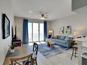 a living room with a couch and a table at Inn at Summerwinds #1403 in Navarre +24 photos