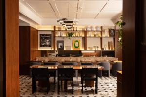 a dining room with a table and chairs at c-hotels Club in Florence +20 photos