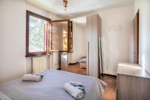 Postel nebo postele na pokoji v ubytování La Chiave D'Oro