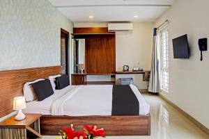 TV a/nebo společenská místnost v ubytování Collection O SSR Royal Suites + 27 fotografií