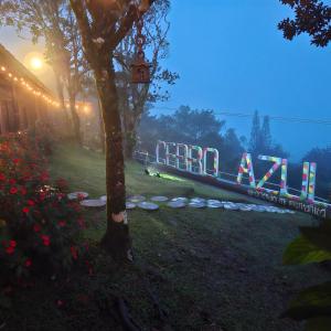a sign that reads eternalaan in a park at night at Hacienda Mi Montañita in Los Altos de Cerro Azul