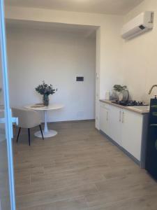 a kitchen with a table and a table at B&B La Fenice in Chieti