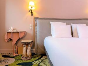 Postel nebo postele na pokoji v ubytování Hotel Mercure Parc du Coudray - Barbizon + 156 fotografií