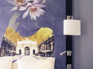 Postel nebo postele na pokoji v ubytování Mercure Nancy Centre Place Stanislas + 147 fotografií