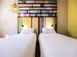 Postel nebo postele na pokoji v ubytování ibis Styles Perpignan Centre Gare