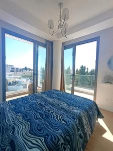 Ένα ή περισσότερα κρεβάτια σε δωμάτιο στο Blue Oasis Apartment