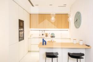 Kuchyň nebo kuchyňský kout v ubytování Homiday - Poseidon Luxury