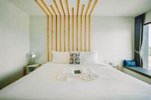 Ένα ή περισσότερα κρεβάτια σε δωμάτιο στο The Galla Hotel