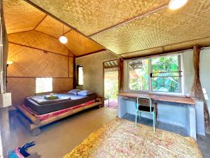 Postel nebo postele na pokoji v ubytování Sun Moon Pai Bungalow