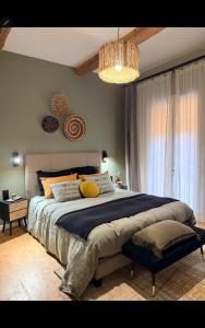 Postel nebo postele na pokoji v ubytování le J&J Appartement spacieux climatisé en centre ville