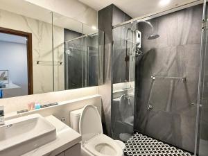 a bathroom with a shower and a toilet and a sink at New great pool and gym condo chiangmai in Chiang Mai