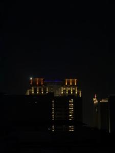 a view of a city at night with lights at Hotel Royal Inn in Ahmedabad