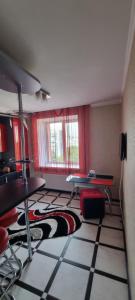 a living room with a rug on the floor at Khmelnitsky in Zarechʼye +4 photos