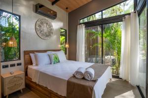 Postel nebo postele na pokoji v ubytování Villa Asencia with pool and AC near Arrecife beach + 69 fotografií