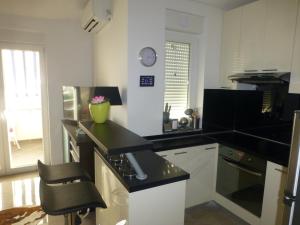 Kuchyň nebo kuchyňský kout v ubytování Appartement Zagi