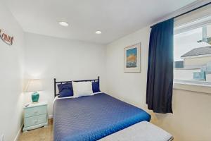 Ένα ή περισσότερα κρεβάτια σε δωμάτιο στο Pacific Blue