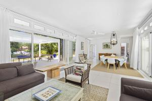 a living room with a couch and a table at Croix Du Sud by Host Agents in Palmar