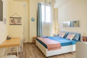 Ένα ή περισσότερα κρεβάτια σε δωμάτιο στο BolognaFiera