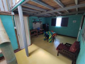 an overhead view of a room with chairs and a table at Hostal Casa Pijao in Pijao +3 photos