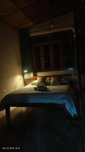 Postel nebo postele na pokoji v ubytování WanKai Homestay