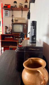 a wooden toilet in a room with a television at Finca de Descanso El Ocaso in Sevilla