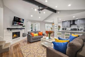 a living room with two couches and a fireplace at Great home, great location at a great price! in San Antonio