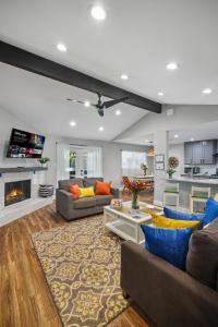 a living room with two couches and a fireplace at Great home, great location at a great price! in San Antonio