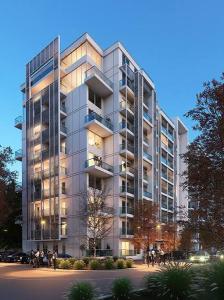 Un palazzo alto con persone che ci stanno davanti di Boutique Apartment 2 a Ploieşti