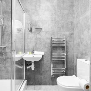 a bathroom with a sink and a toilet and a shower at Cozy Apartment - Netflix - On Street Parking - Rowley Regis 49G in Halesowen