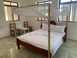 Postel nebo postele na pokoji v ubytování CAAA Youth Hostel