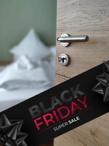 a close up of a black friday sign with a door knob at Apartment Marissa in Billerbeck