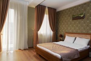 Postel nebo postele na pokoji v ubytování Hotel Gureli