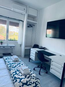 TV a/nebo společenská místnost v ubytování Monopoly Plus